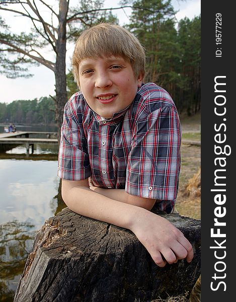 Boy fishing on the shores of beautiful Lake