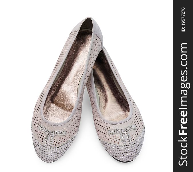 Female shoes with crystals are isolated on the white. Female shoes with crystals are isolated on the white