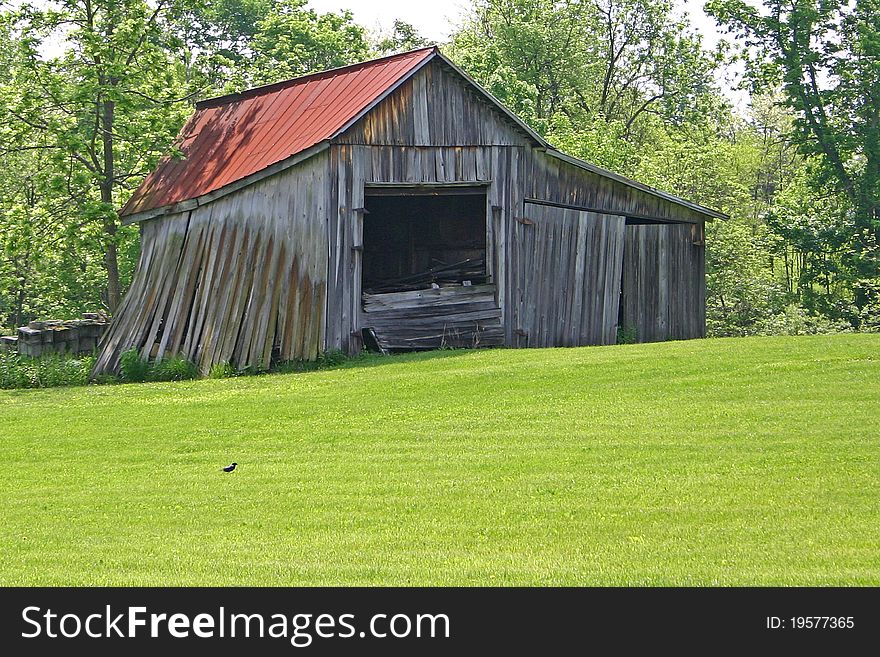 A small barn in Ohio leaning perilously. A small barn in Ohio leaning perilously