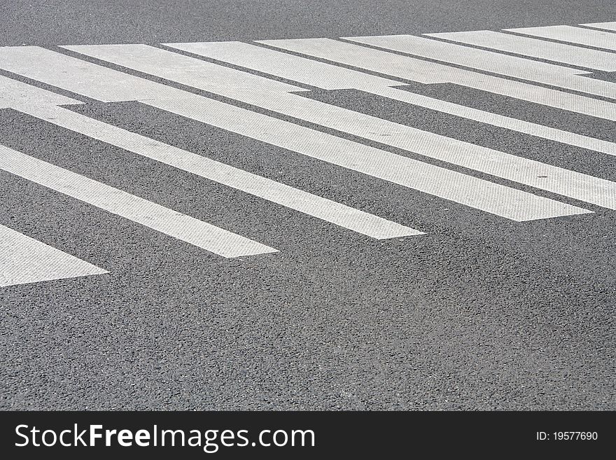 White piano painted pedestrian crossing on the road in Warsaw, Poland. Abstract musical background.