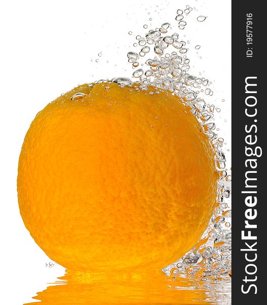 A macro shot of a whole orange under water with bubbles rising. A macro shot of a whole orange under water with bubbles rising.