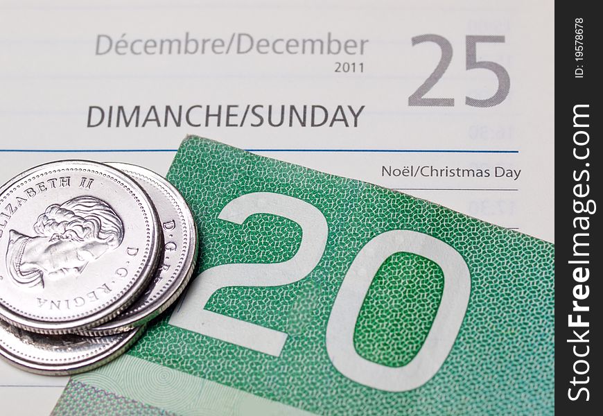 Christmas page in an agenda with paper money and coins. Christmas page in an agenda with paper money and coins