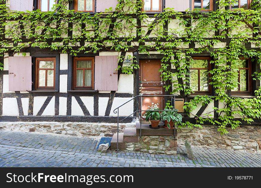 An historical Fachwer house (Half Timbered) covered in vines in the beautiful town of Kronberg, near Frankfurt. An historical Fachwer house (Half Timbered) covered in vines in the beautiful town of Kronberg, near Frankfurt.