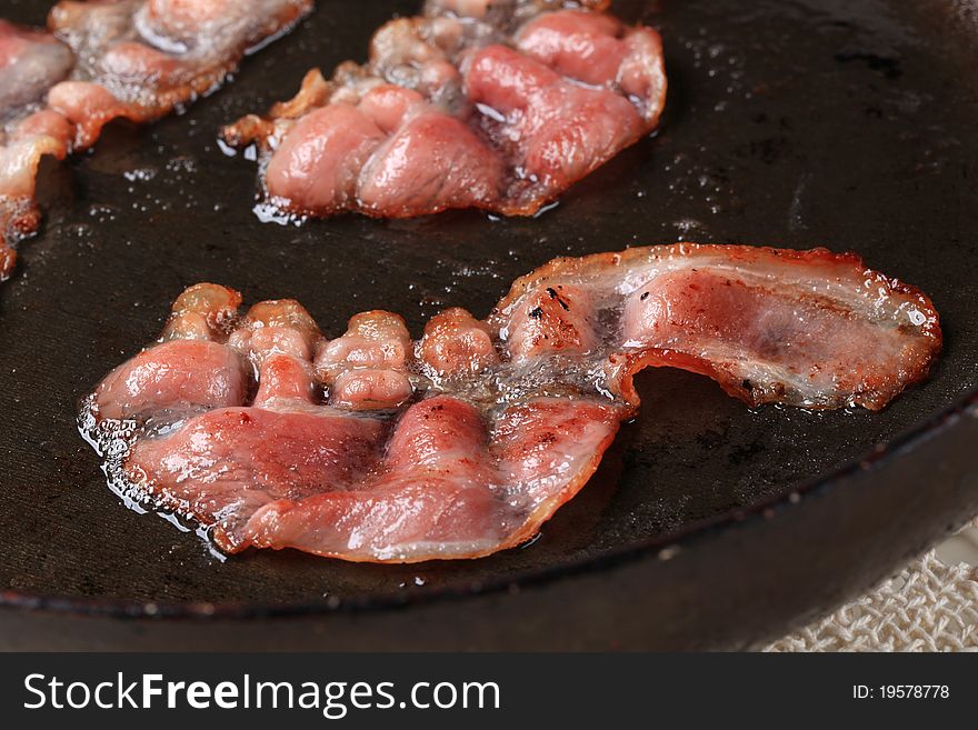 Pan roasted rashers of bacon - detail. Pan roasted rashers of bacon - detail