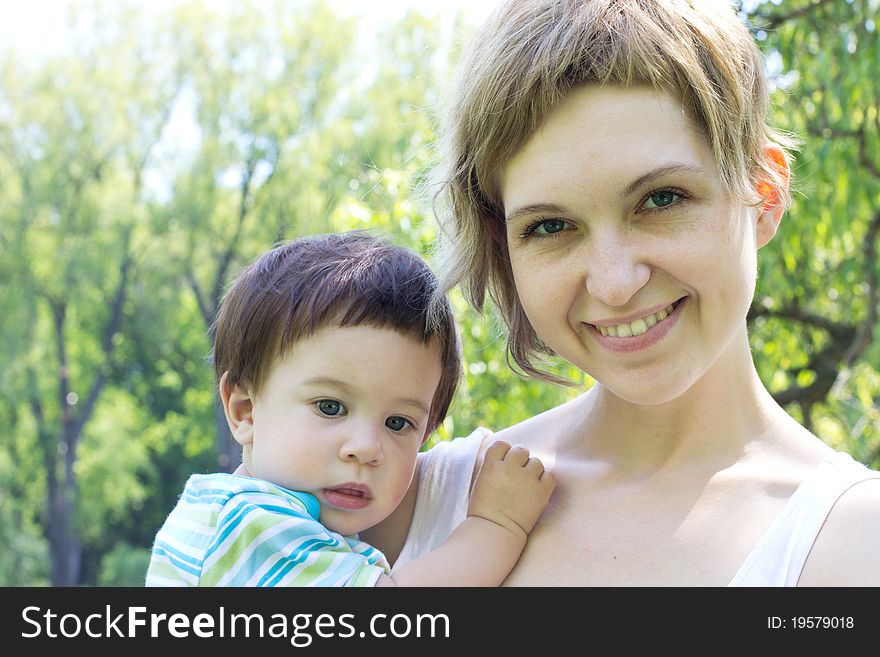 Young mother with little son at the park. Young mother with little son at the park