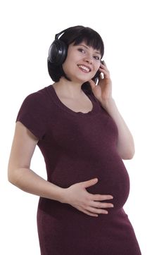 Pregnant Woman Listening To Music. Stock Photo Pregnant Woman Listening To Music. Stock Photo