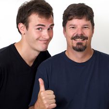 Older Man Showing Thumbs Up To Younger Man Royalty Free Stock Image