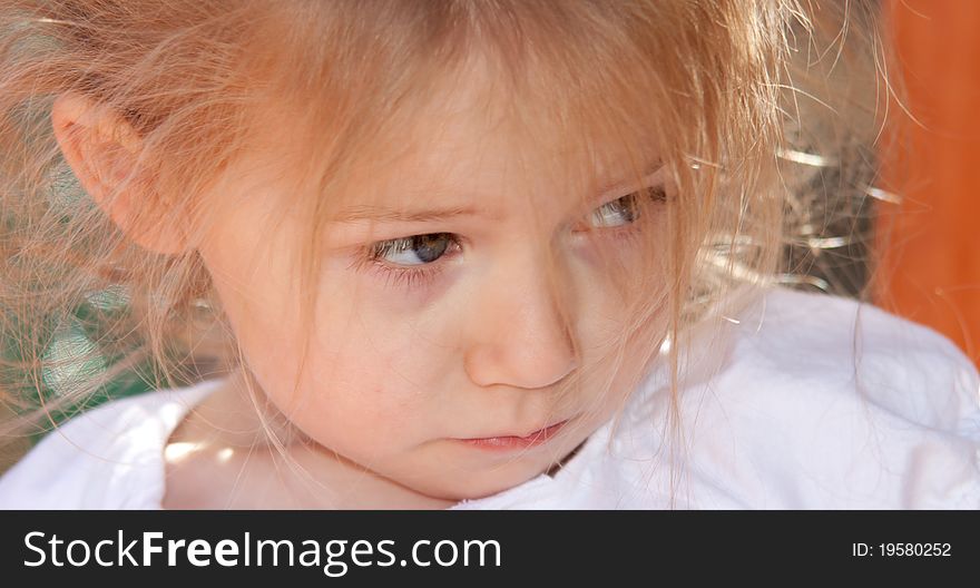 A photograph of an adorable child playing on some playground equipment. A photograph of an adorable child playing on some playground equipment.