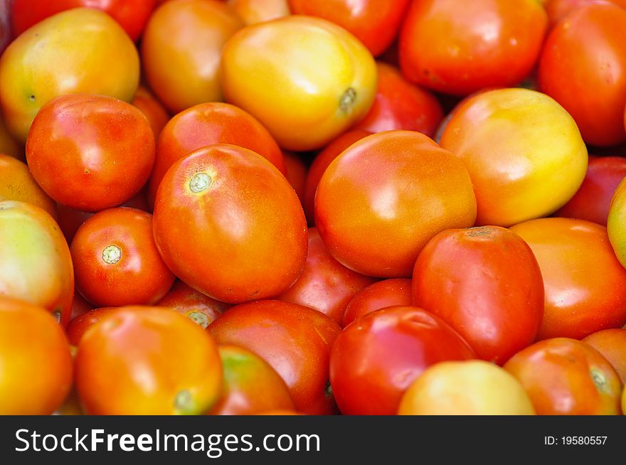 Background of fresh tomatoes on the market. Background of fresh tomatoes on the market