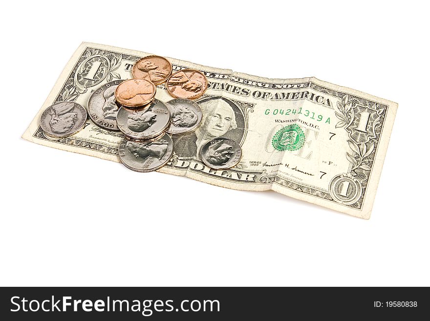 Pile of paper money and change on isolated white. Pile of paper money and change on isolated white