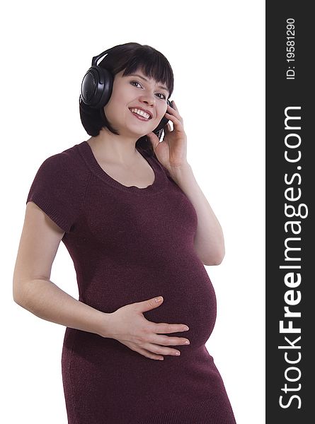 Pregnant Woman Listening To Music.