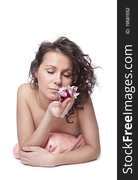 Beautiful Woman Smelling A Flower