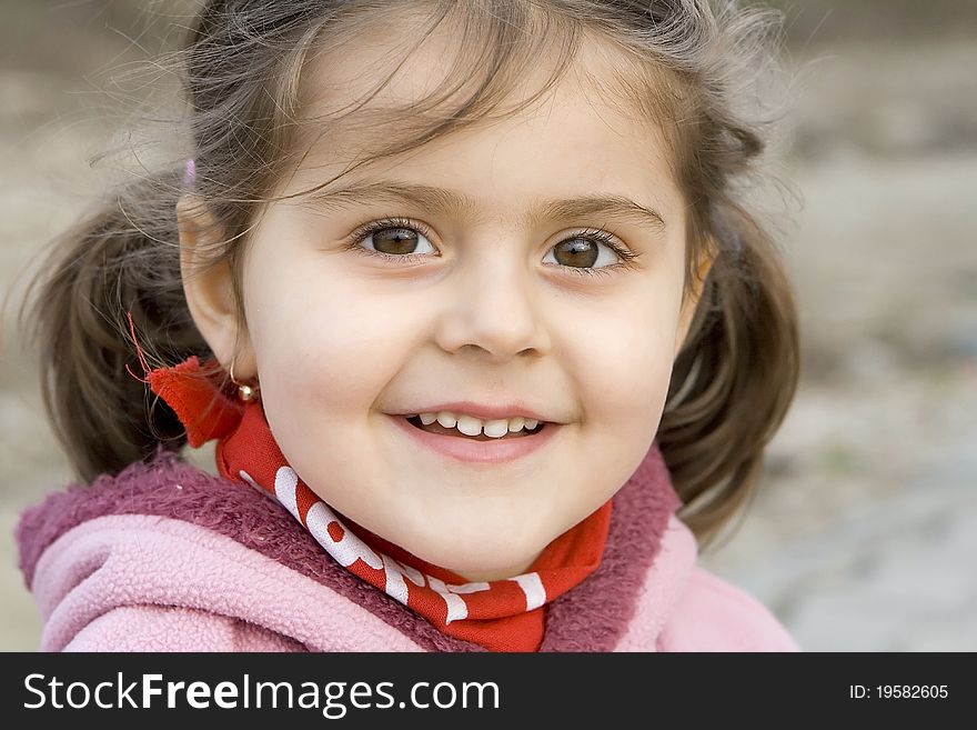 Little girl smiling with atractive look. Little girl smiling with atractive look