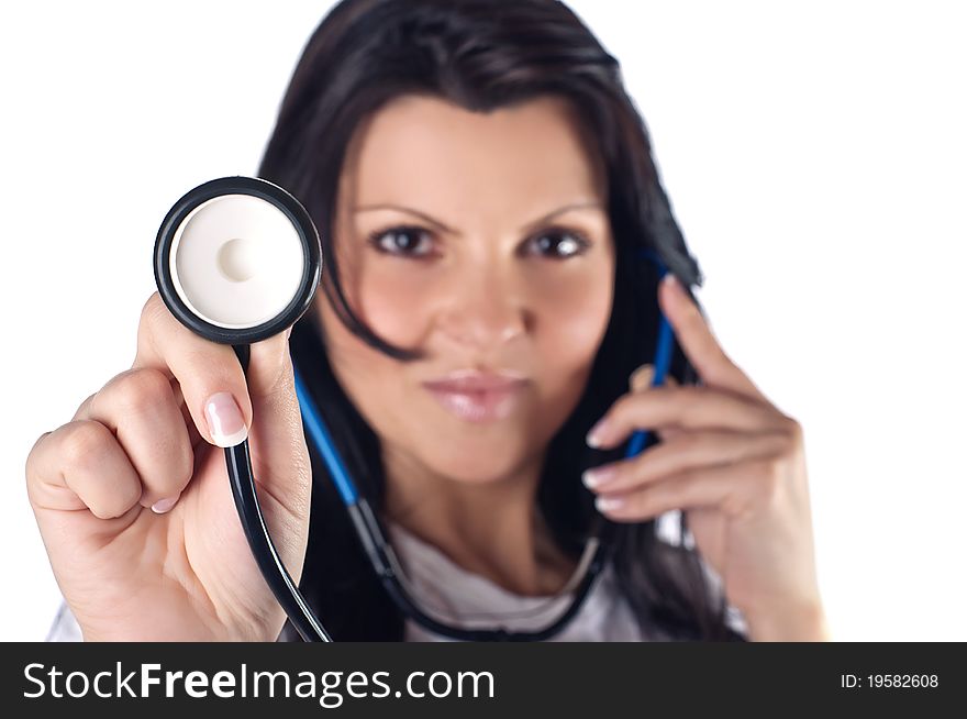 Pretty nurse holding stethoscope, studio shot