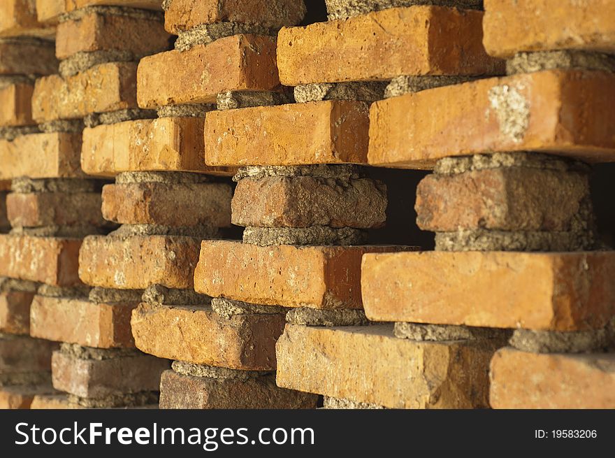 Photo of orange brick wall ornament cross