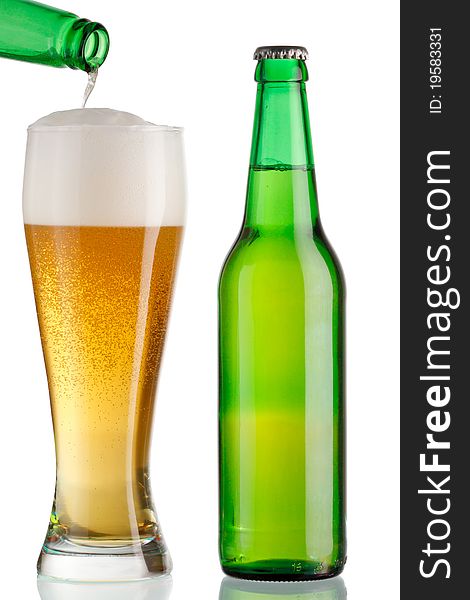 Cup and a bottle of beer on white background. Cup and a bottle of beer on white background