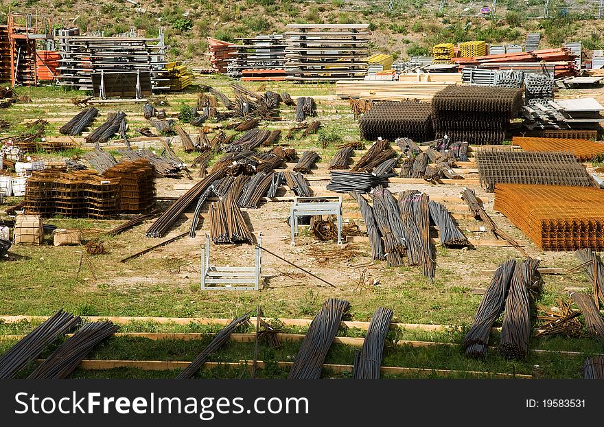 Construction material storage area with reinforcing steel mesh , iron rods and formwork material. Construction material storage area with reinforcing steel mesh , iron rods and formwork material