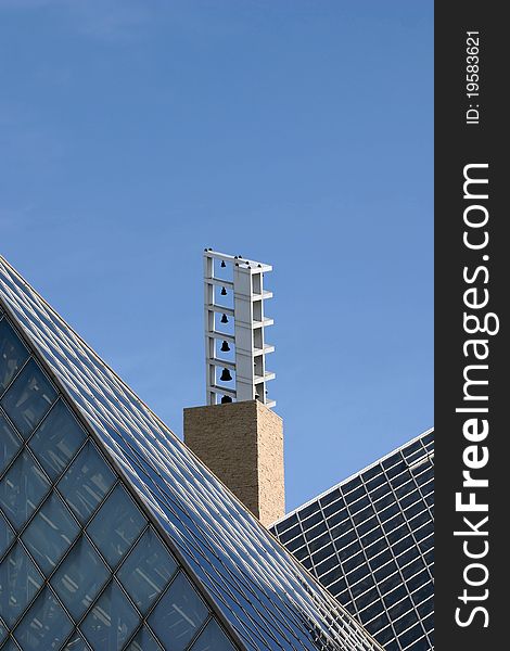 Carillon belltower between slanted rooftops. Carillon belltower between slanted rooftops.