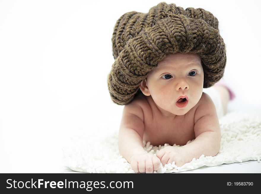 The little boy wearing the big brown hat. The little boy wearing the big brown hat