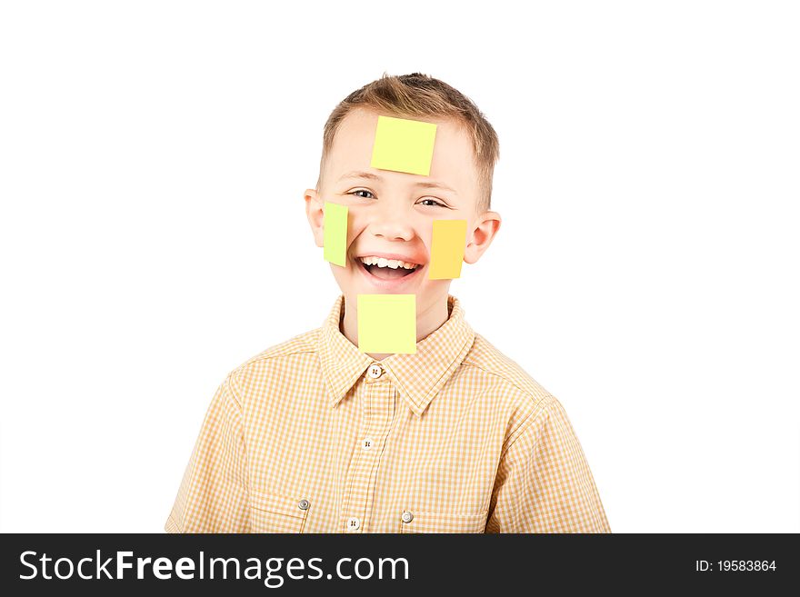Portrait of a boy with colorful funny stickers on his face. Portrait of a boy with colorful funny stickers on his face.