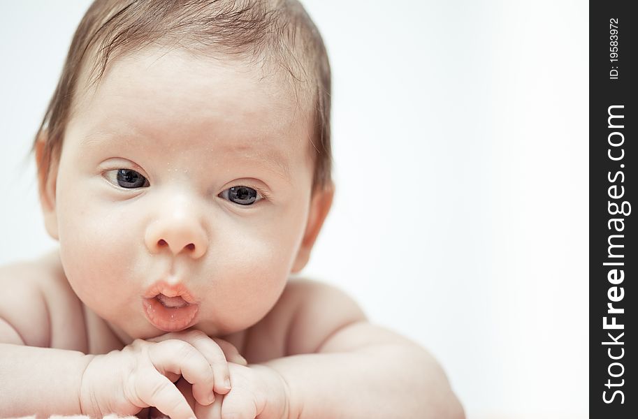 The close-up portrait of a little baby. The close-up portrait of a little baby