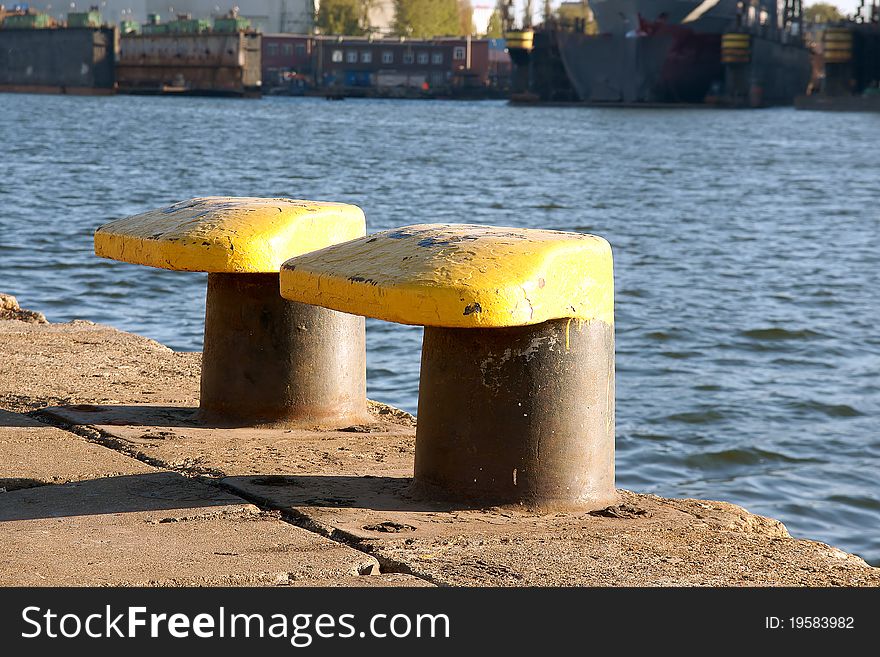Shipbuilding bollards  in the sunshine waiting for the mooring