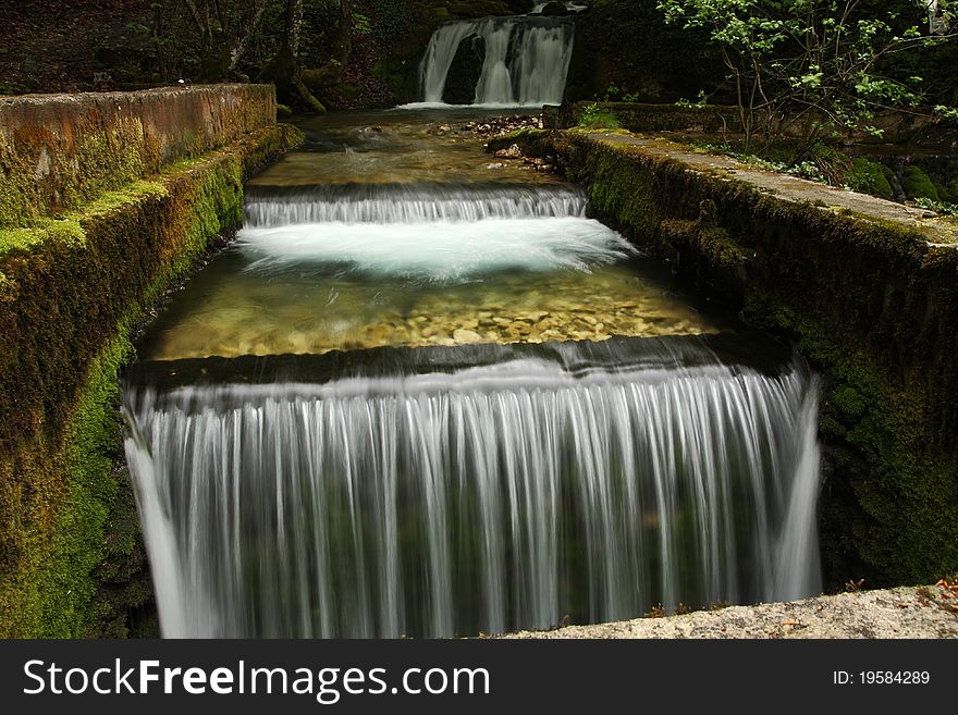 Beautiful river forming small waterfalls in a forest. Beautiful river forming small waterfalls in a forest