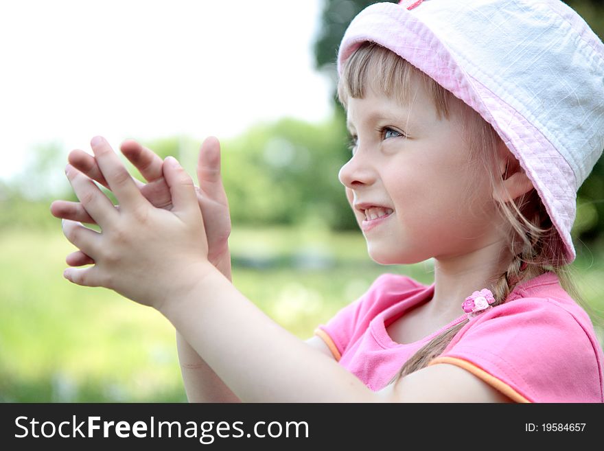 Portrait of laughing little girl outdoor