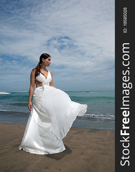 Happy bride in white on the beach. Happy bride in white on the beach