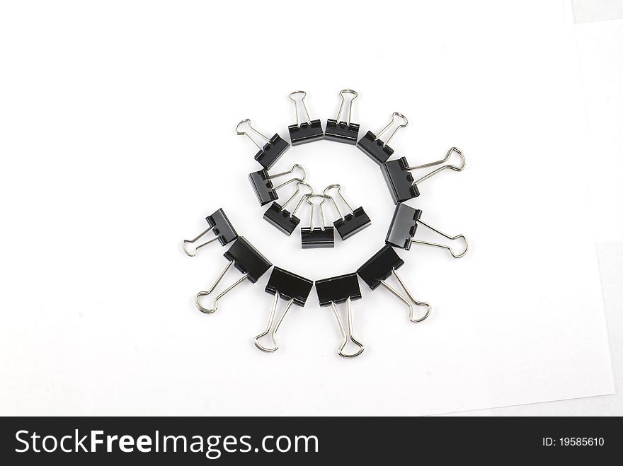 Binder clips in a circle isolated on white background