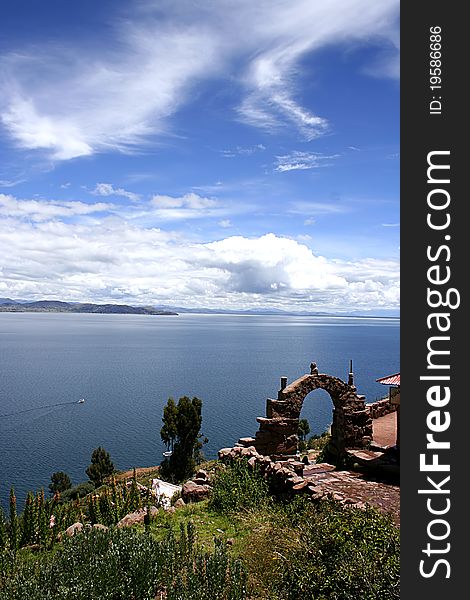 View from isla del sol Lake Titicaca through an ancient stone arch