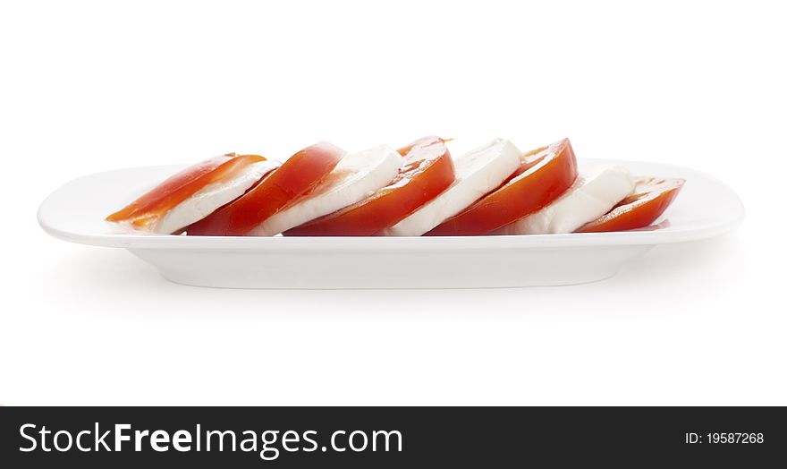 Mozarella and tomatoes isolated on white background. Mozarella and tomatoes isolated on white background