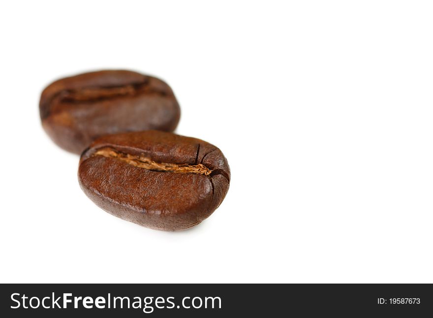Aromatic coffee beans on a white background. Aromatic coffee beans on a white background.