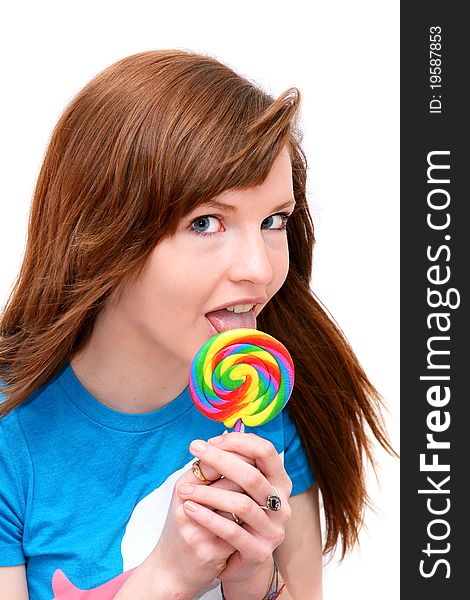 Teen girl with colorful lollipop on a white background. Teen girl with colorful lollipop on a white background