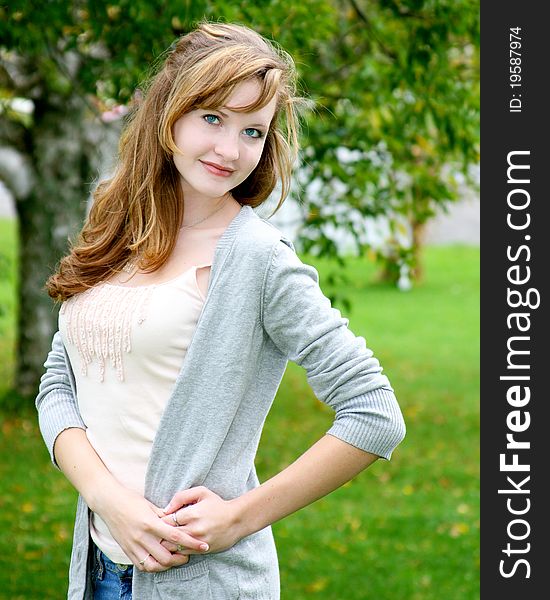 Pretty teen girl striking a pose in the great outdoors. Pretty teen girl striking a pose in the great outdoors