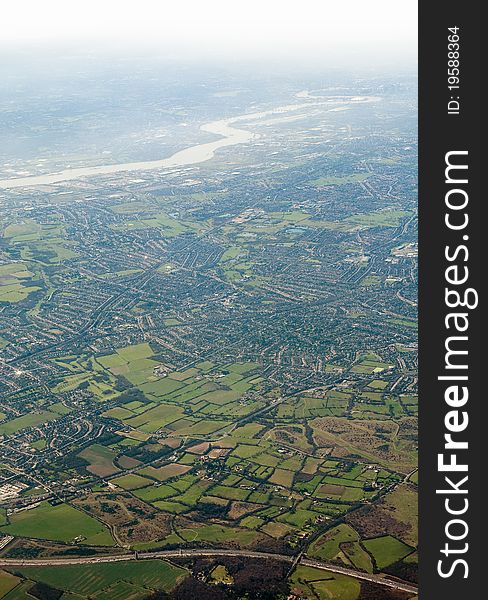 Landscape viewed from airplane, photo taken near London, Themes river in distance. Landscape viewed from airplane, photo taken near London, Themes river in distance