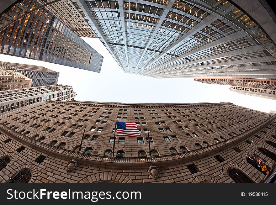 General architecture with American flag, fish-eye photo taken in New York, USA. General architecture with American flag, fish-eye photo taken in New York, USA.