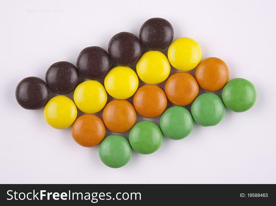 Chocolate rhythm, ordered rows of colored candies