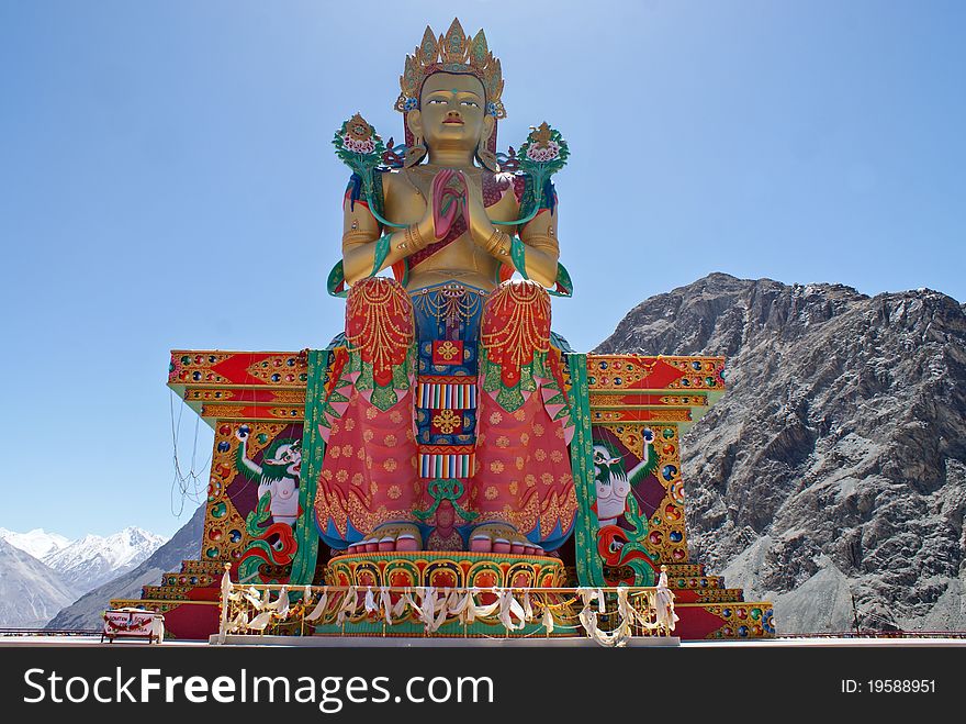 Buddhist Statue Against Himalayas