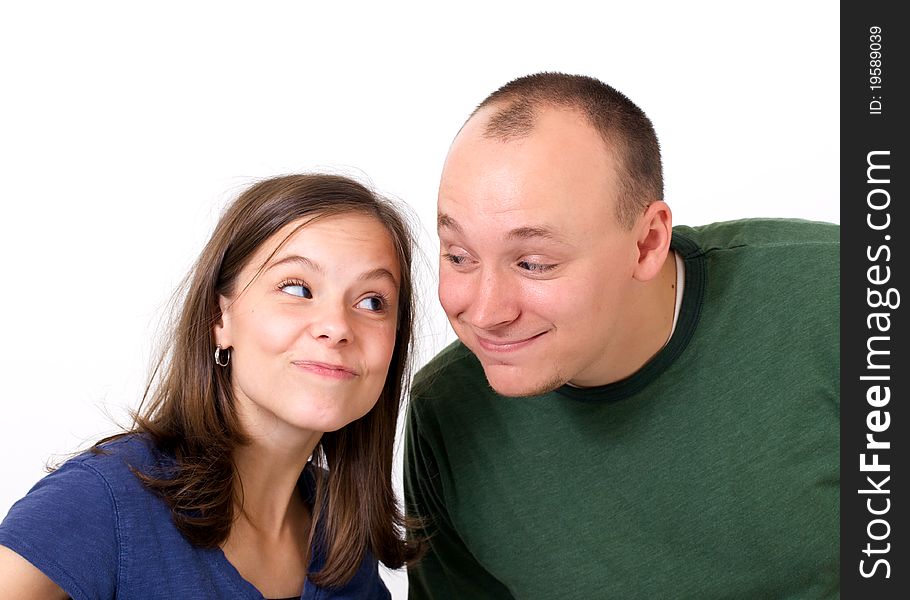 Young couple smiling with silly expressions. Young couple smiling with silly expressions.