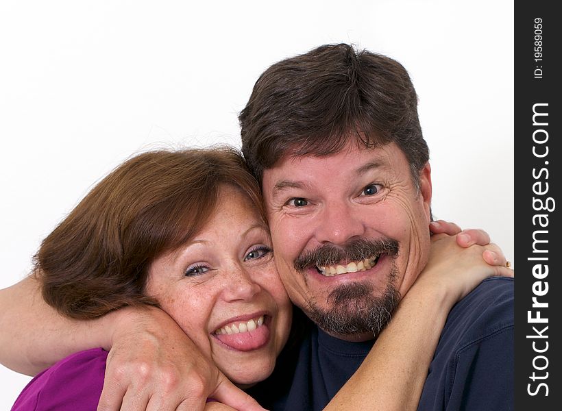Man and wife enthusiastically hugging each other in love and devotion