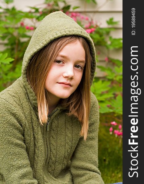 A portrait of a young girl in the garden. A portrait of a young girl in the garden.