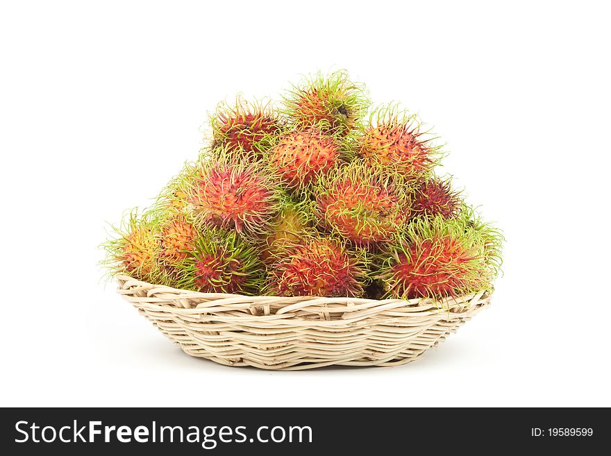 Isolated rambutans in a basket