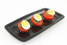 Quail Eggs And Tomatoes Stock Photo