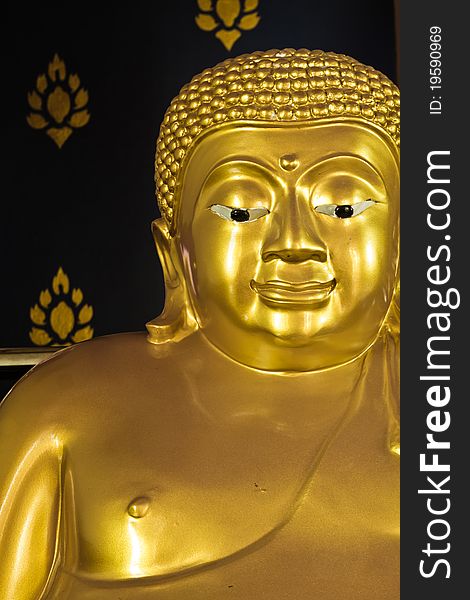 Golden Buddhism's statue with black wall design background. Golden Buddhism's statue with black wall design background