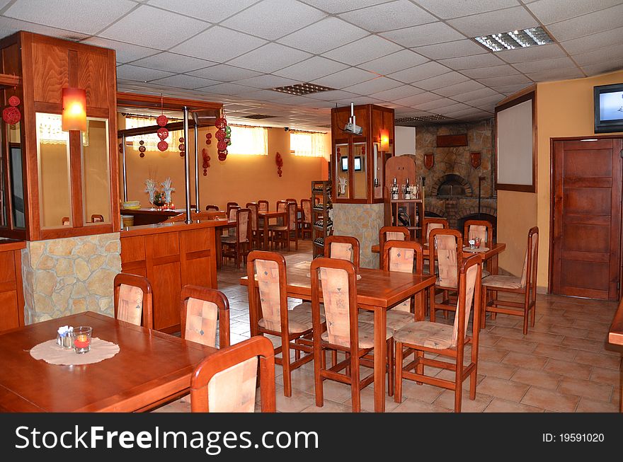There is empty pizzeria without guests ready for opening.