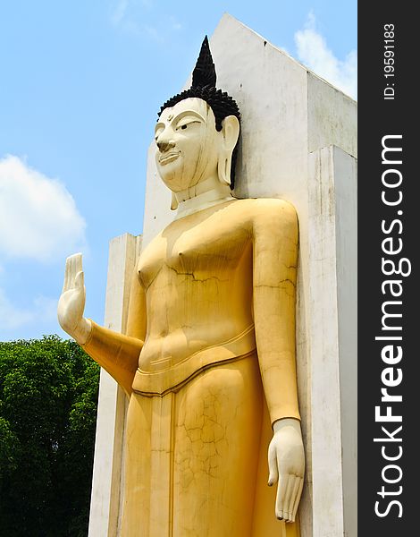 Yellow Buddha's statue in the Central of Thailand