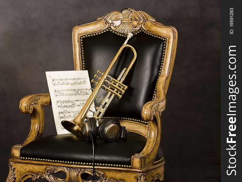 Trumpet and music on chair. The session is over. Trumpet and music on chair. The session is over.