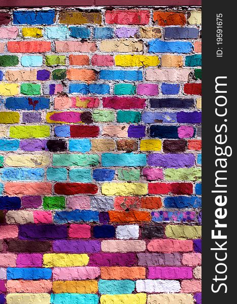 Outdoor street wall from many colour bricks