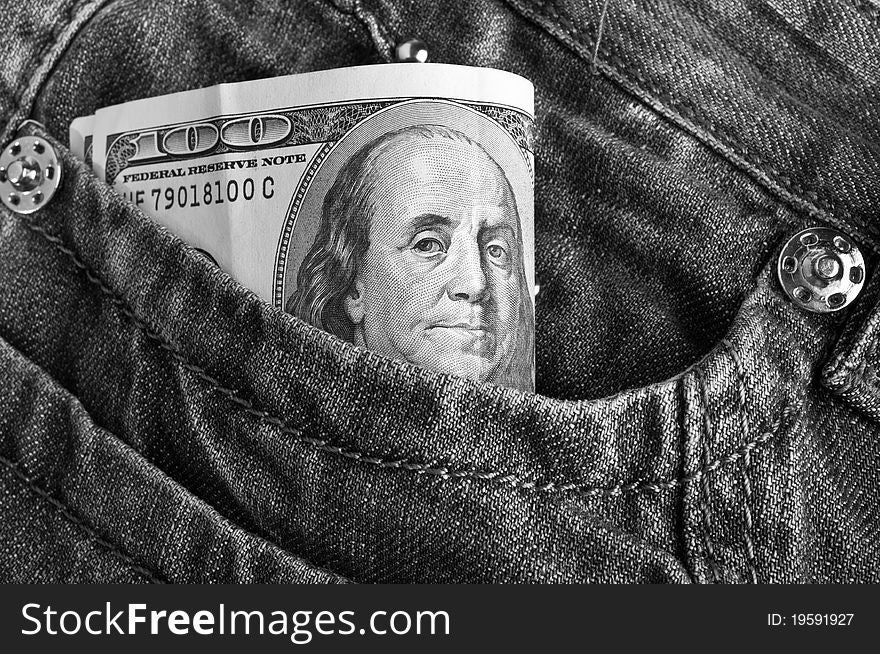 American dollar bills in jeans pocket background